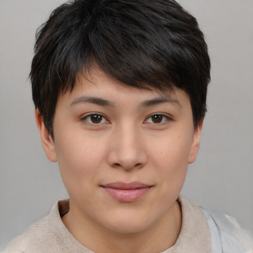 Joyful asian young-adult female with short  brown hair and brown eyes