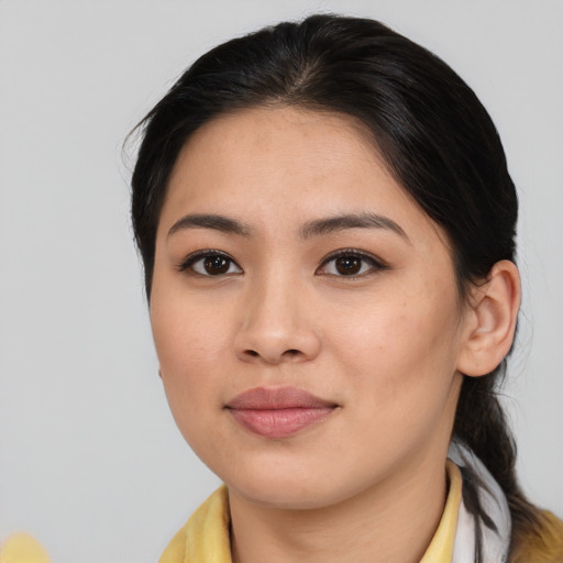 Joyful asian young-adult female with medium  brown hair and brown eyes