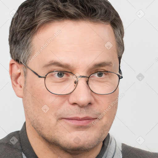 Joyful white adult male with short  brown hair and grey eyes