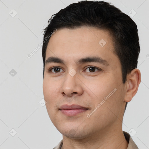 Joyful white young-adult male with short  black hair and brown eyes