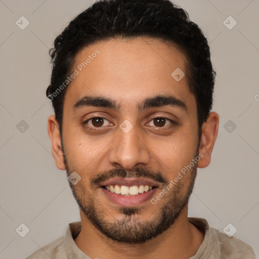 Joyful latino young-adult male with short  black hair and brown eyes