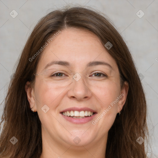 Joyful white adult female with long  brown hair and grey eyes