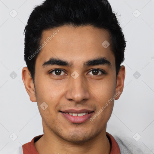 Joyful latino young-adult male with short  brown hair and brown eyes