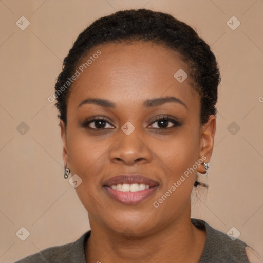 Joyful black young-adult female with short  black hair and brown eyes