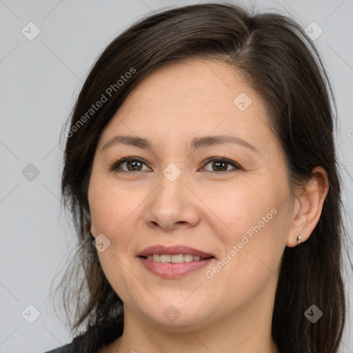 Joyful white adult female with medium  brown hair and brown eyes