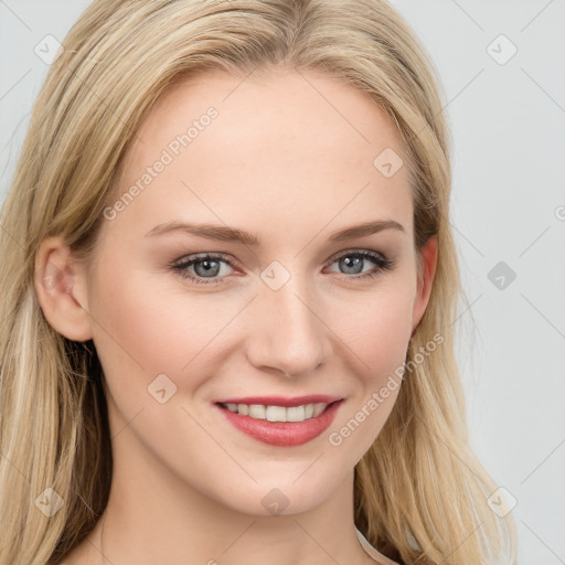 Joyful white young-adult female with long  brown hair and blue eyes