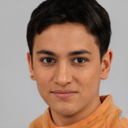 Joyful latino young-adult male with short  brown hair and brown eyes