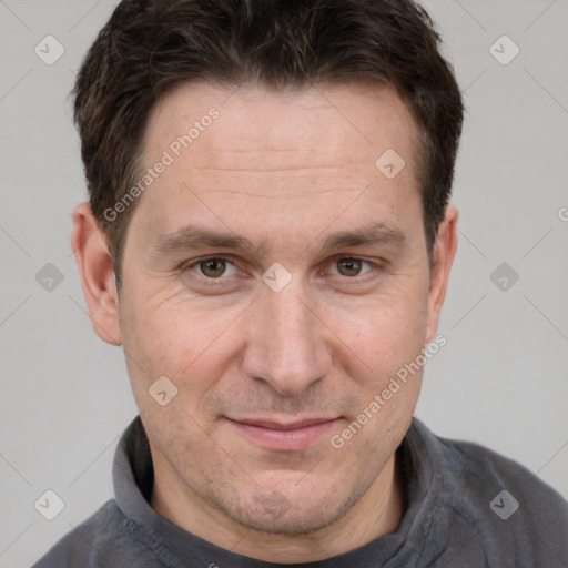 Joyful white adult male with short  brown hair and grey eyes