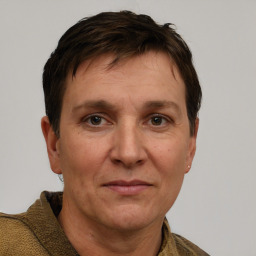 Joyful white adult male with short  brown hair and grey eyes