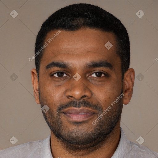 Joyful black young-adult male with short  black hair and brown eyes
