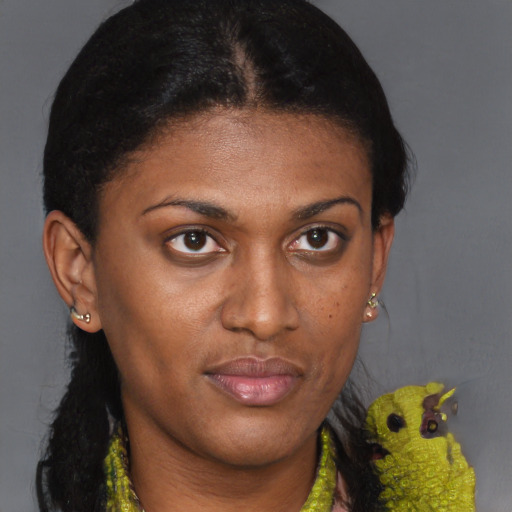 Joyful black young-adult female with short  brown hair and brown eyes