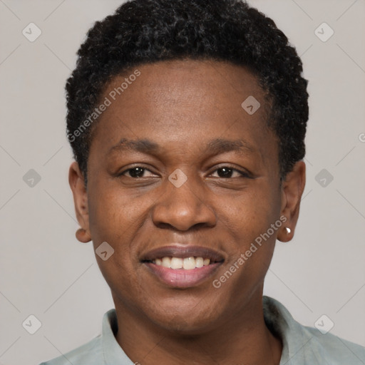 Joyful black adult male with short  black hair and brown eyes