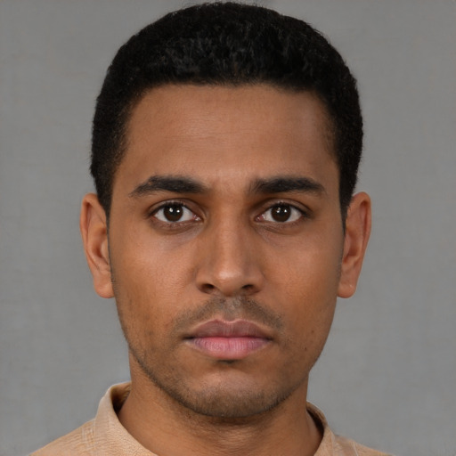 Neutral latino young-adult male with short  brown hair and brown eyes