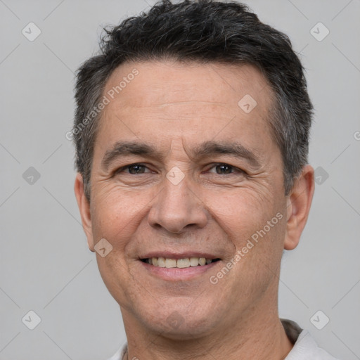 Joyful white adult male with short  brown hair and brown eyes