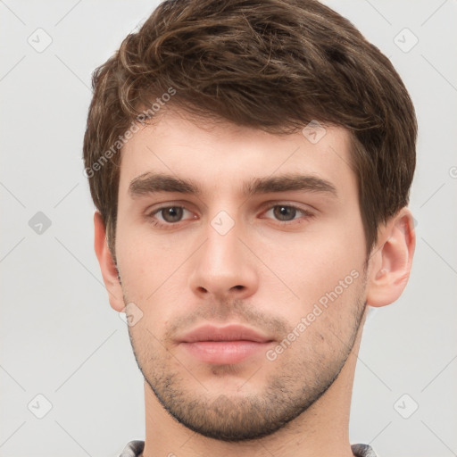 Neutral white young-adult male with short  brown hair and grey eyes