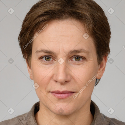 Joyful white adult female with short  brown hair and grey eyes