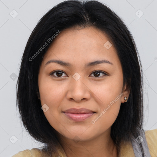 Joyful latino young-adult female with medium  brown hair and brown eyes