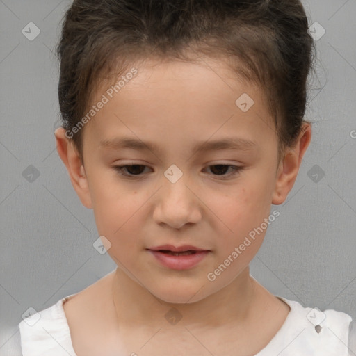 Joyful white child female with short  brown hair and brown eyes