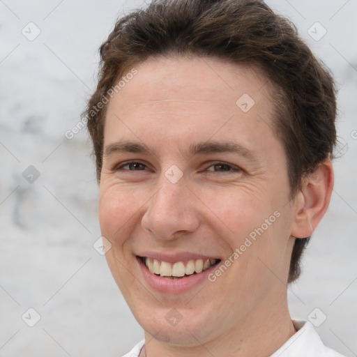 Joyful white adult female with short  brown hair and brown eyes