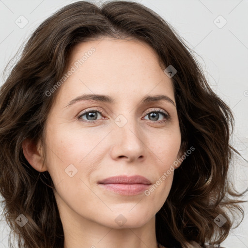 Joyful white young-adult female with long  brown hair and green eyes