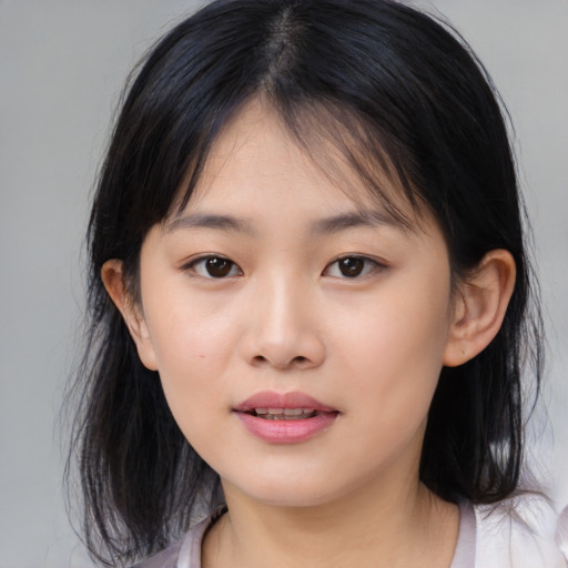 Neutral asian young-adult female with medium  brown hair and brown eyes