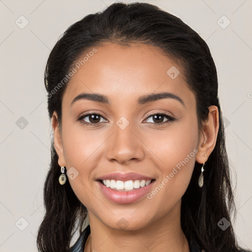 Joyful white young-adult female with long  brown hair and brown eyes