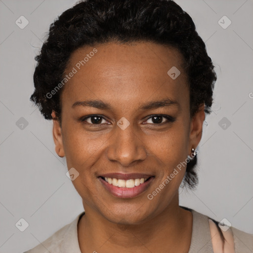 Joyful black young-adult female with short  black hair and brown eyes