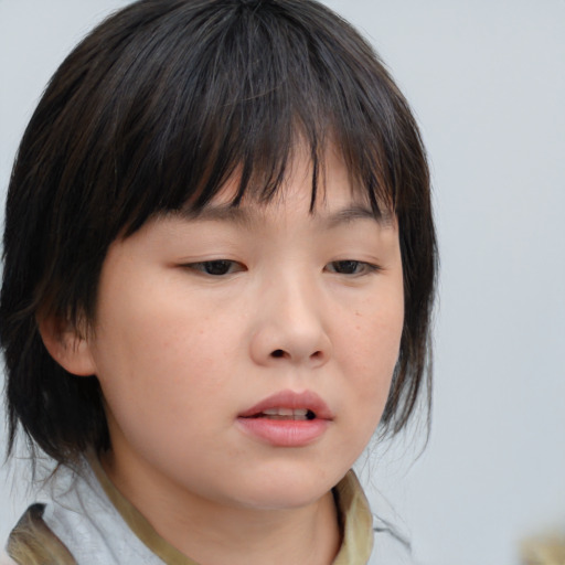 Neutral asian child female with medium  brown hair and brown eyes