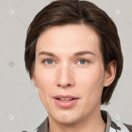 Joyful white young-adult female with medium  brown hair and grey eyes