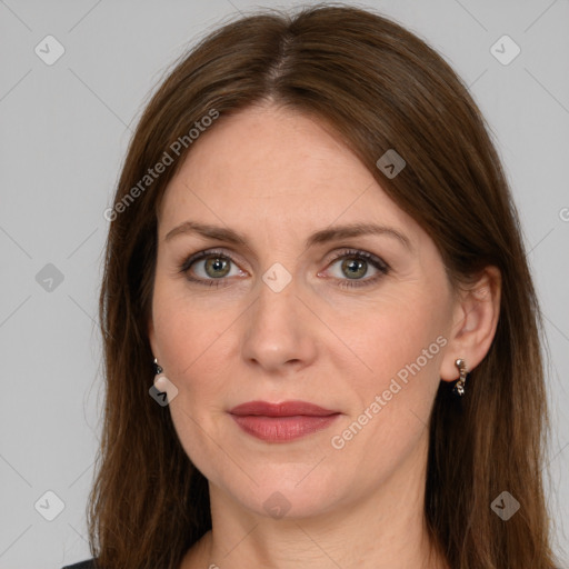 Joyful white adult female with long  brown hair and grey eyes