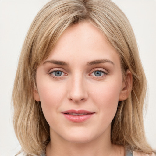 Joyful white young-adult female with long  brown hair and blue eyes