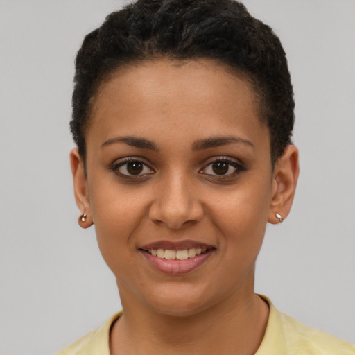 Joyful latino young-adult female with short  brown hair and brown eyes