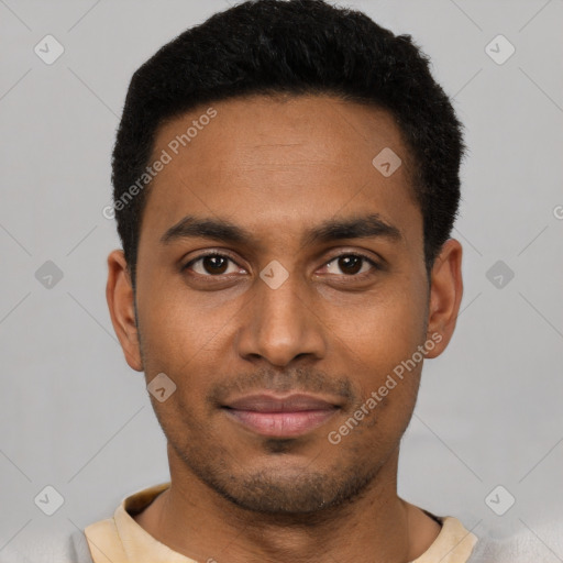 Joyful latino young-adult male with short  black hair and brown eyes