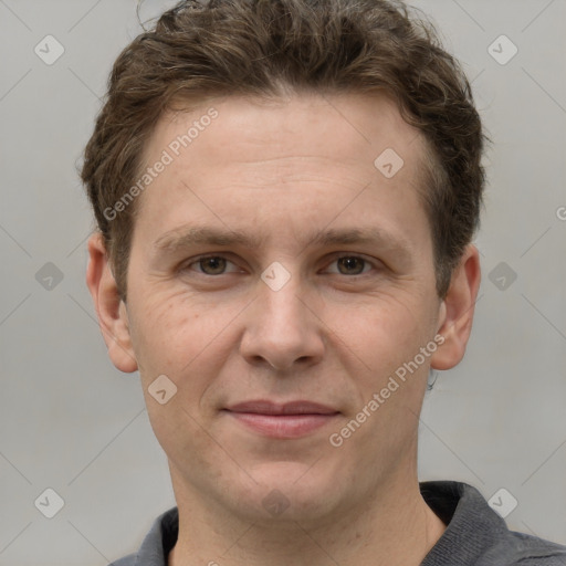 Joyful white adult male with short  brown hair and grey eyes