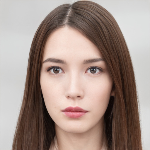 Neutral white young-adult female with long  brown hair and brown eyes