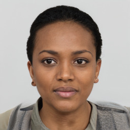 Neutral black young-adult female with short  black hair and brown eyes