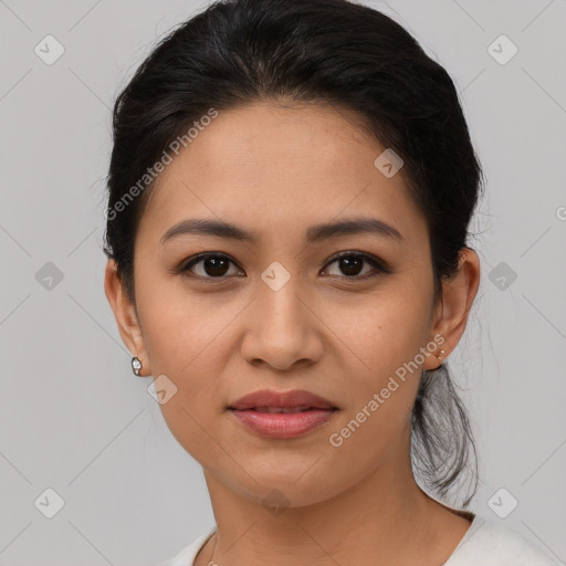 Joyful latino young-adult female with medium  brown hair and brown eyes