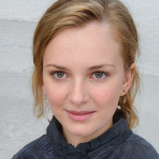 Joyful white young-adult female with medium  brown hair and blue eyes