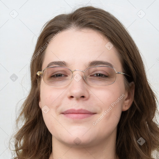 Joyful white young-adult female with long  brown hair and blue eyes