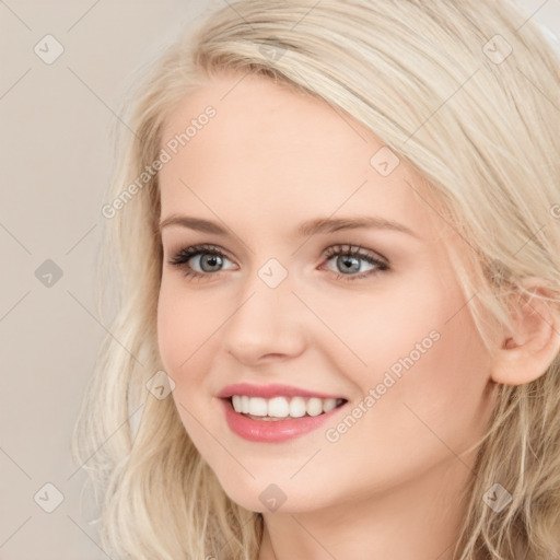 Joyful white young-adult female with long  brown hair and blue eyes