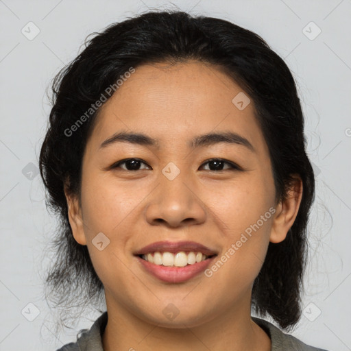 Joyful asian young-adult female with medium  black hair and brown eyes