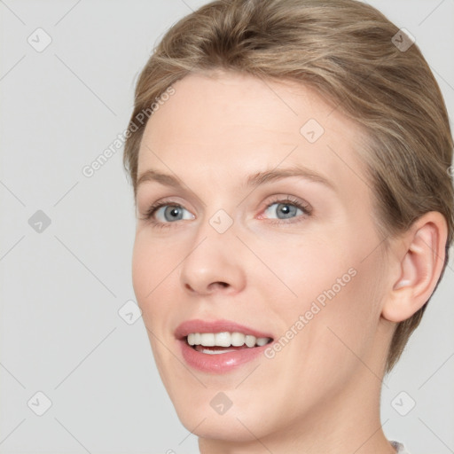 Joyful white young-adult female with short  brown hair and grey eyes