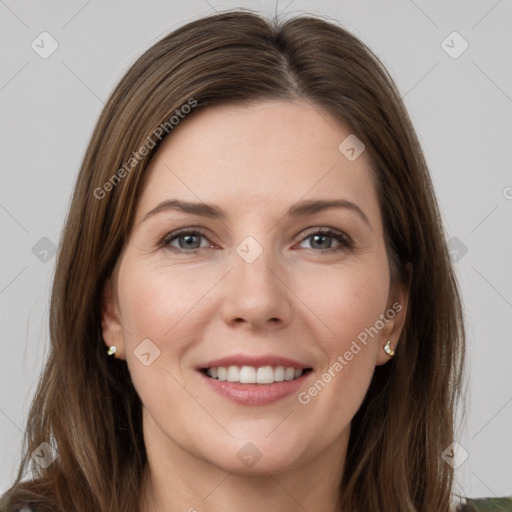 Joyful white young-adult female with long  brown hair and grey eyes