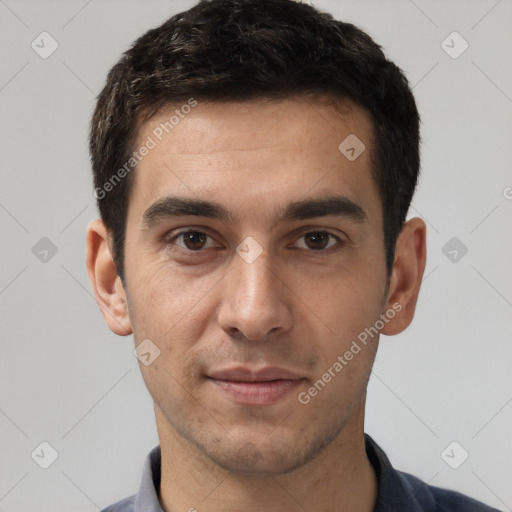 Joyful white young-adult male with short  black hair and brown eyes