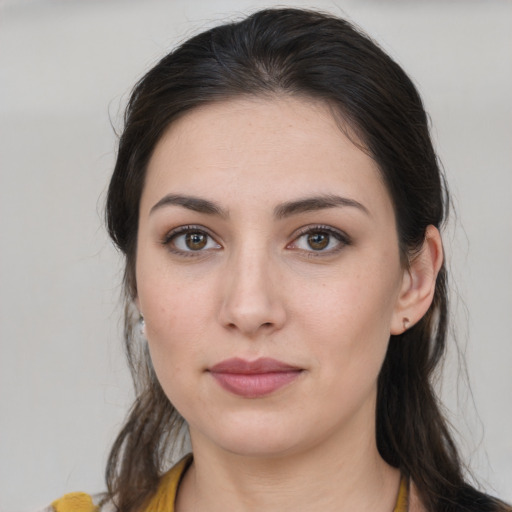 Neutral white young-adult female with long  brown hair and brown eyes