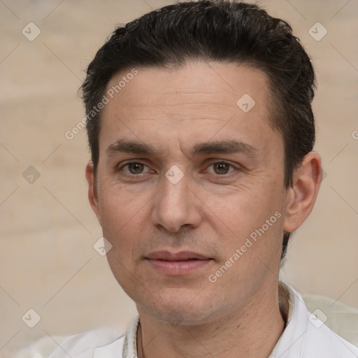 Joyful white adult male with short  brown hair and brown eyes