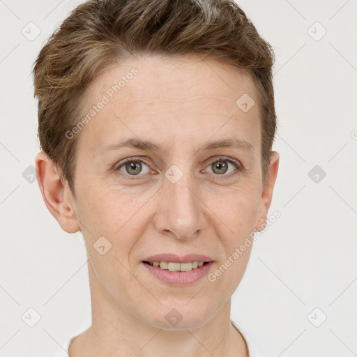 Joyful white adult female with short  brown hair and grey eyes