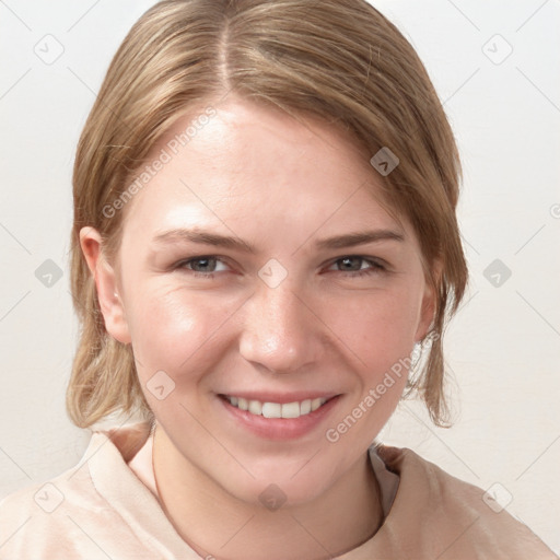 Joyful white young-adult female with medium  brown hair and blue eyes