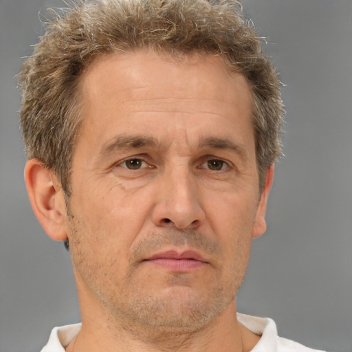 Neutral white middle-aged male with short  brown hair and brown eyes