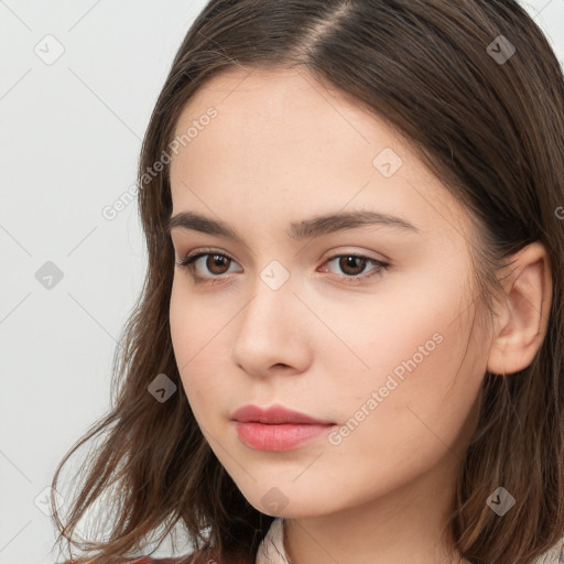 Neutral white young-adult female with long  brown hair and brown eyes